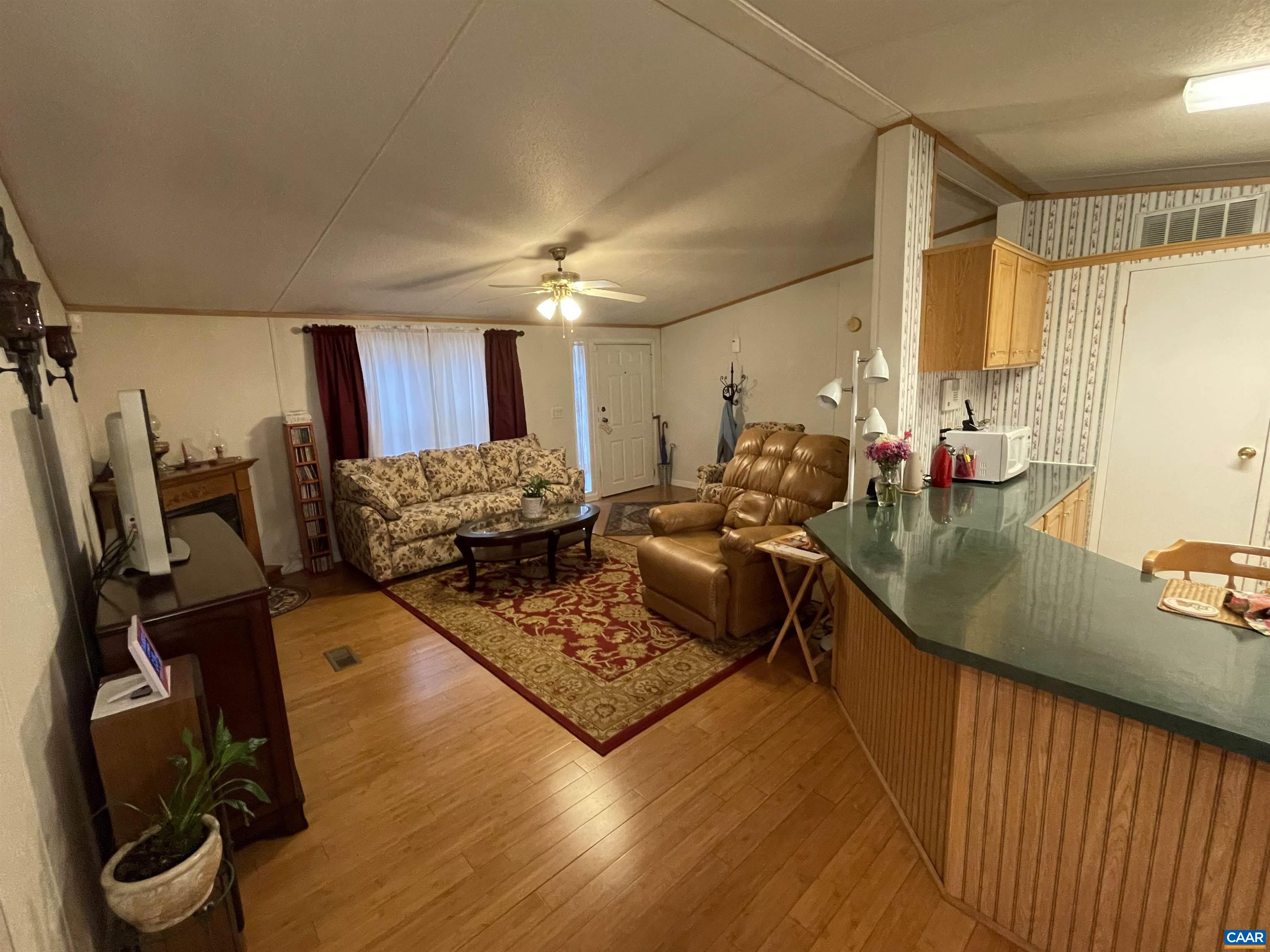 2925 Cloverdale Road Bremo Bluff, VA 23022 - Photo 9 of 23 a living room with furniture and a flat screen tv