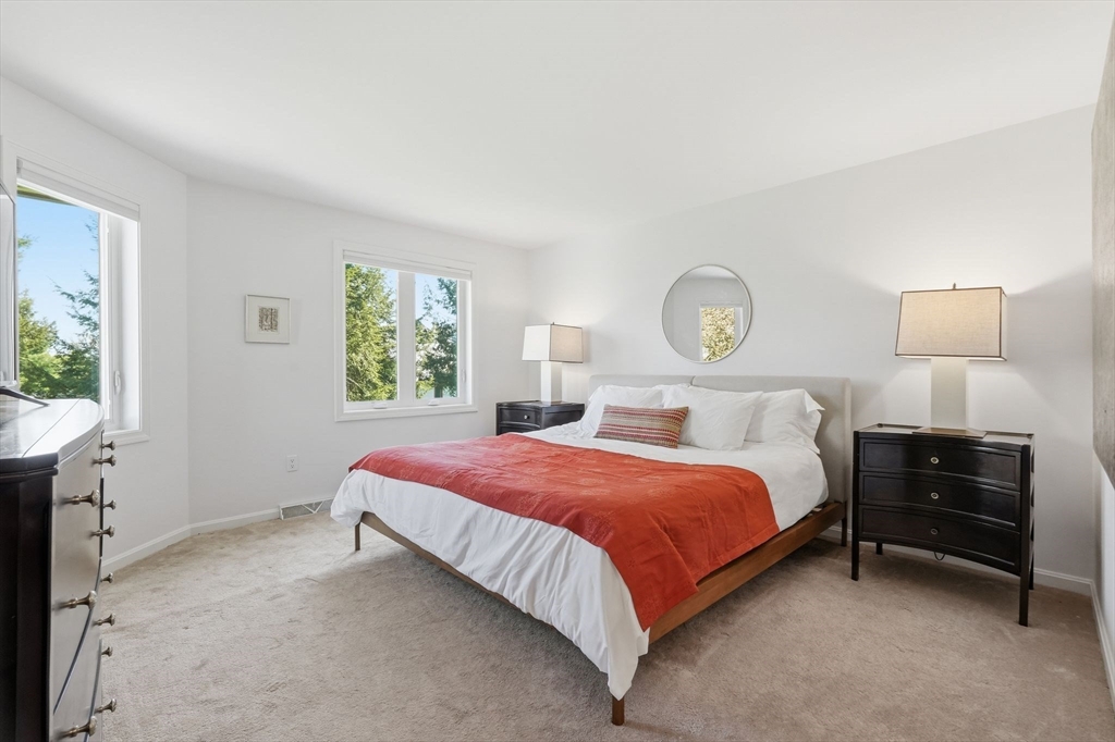 24 McIntosh Drive, Unit 24 Amherst, MA 01002 - Photo 22 of 39 a bedroom with a bed and a window
