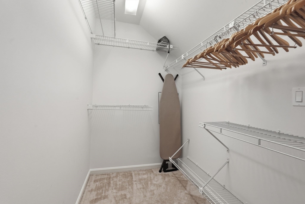 24 McIntosh Drive, Unit 24 Amherst, MA 01002 - Photo 24 of 39 a view of walk in closet with clothes and shoes