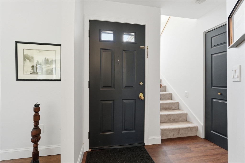 24 McIntosh Drive, Unit 24 Amherst, MA 01002 - Photo 8 of 39 a view of a hallway with wooden floor and entryway