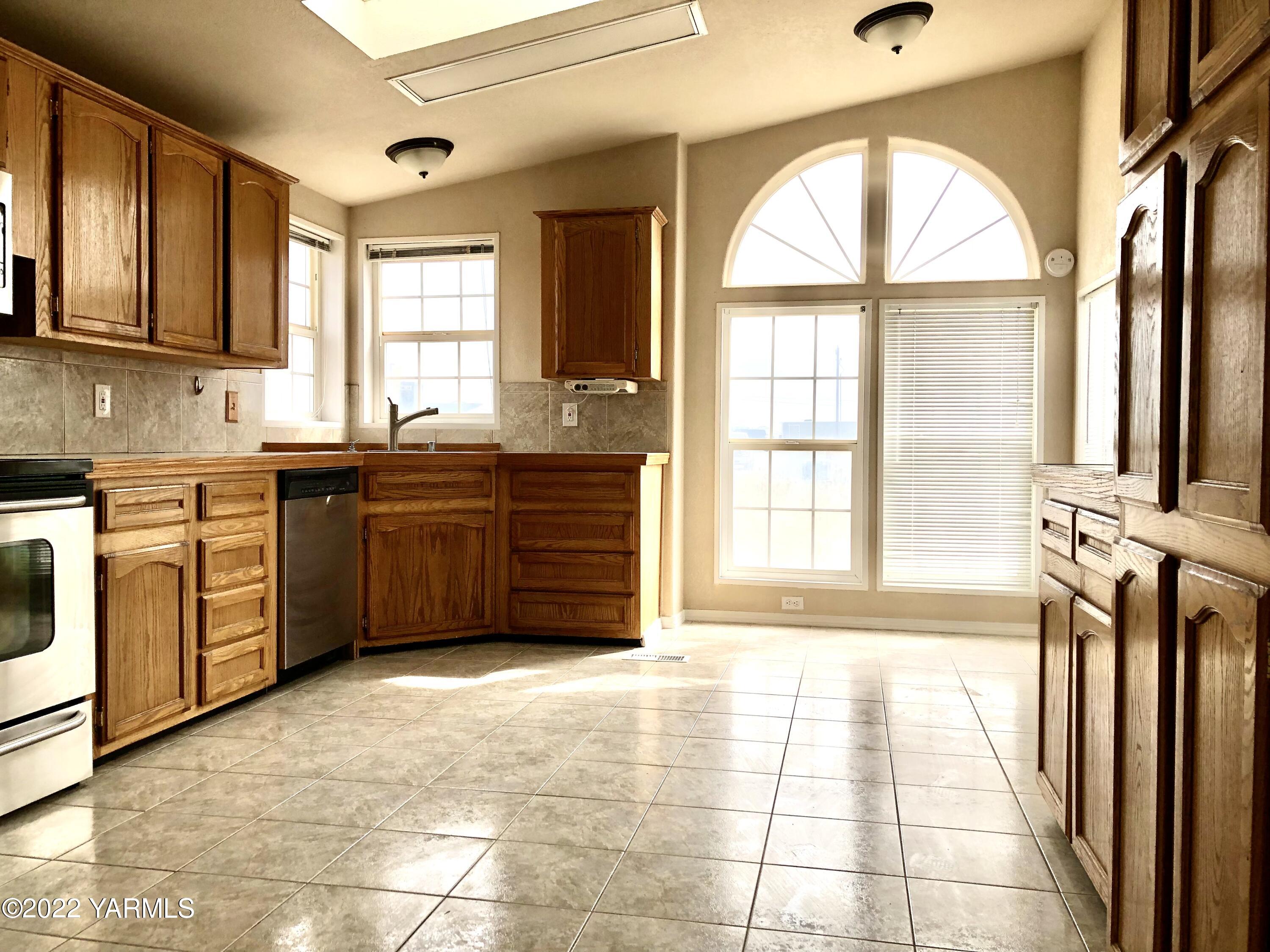 4912 Lateral A Road Wapato, WA 98951 - Photo 14 of 31 a large kitchen with a large window and a sink