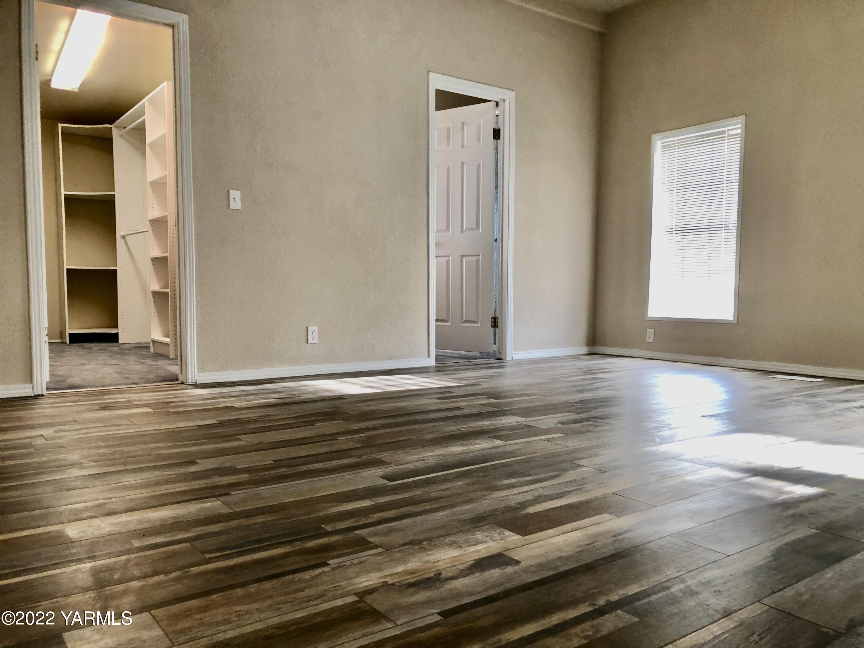 4912 Lateral A Road Wapato, WA 98951 - Photo 15 of 31 a view of room with window and wooden floor