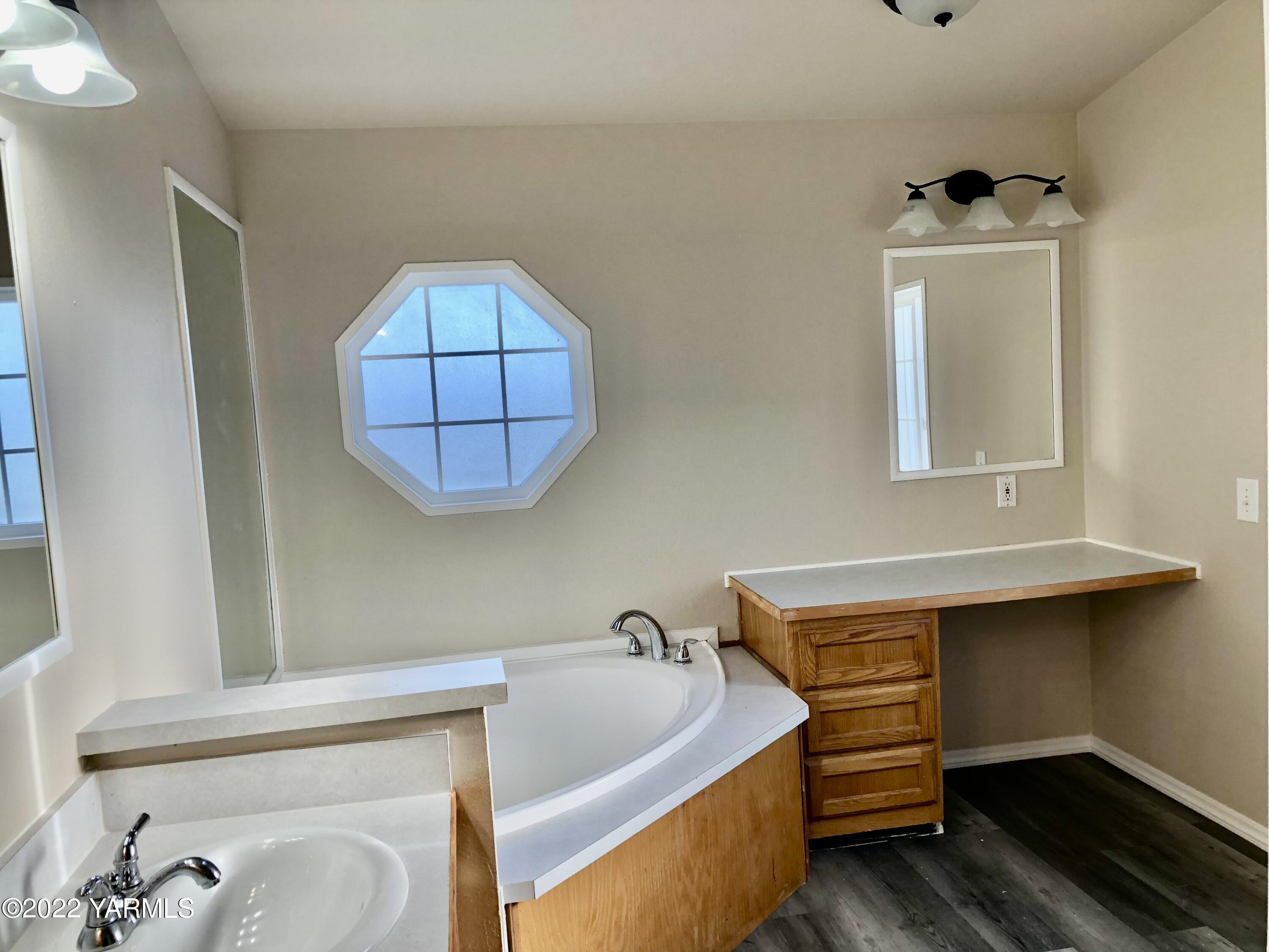 4912 Lateral A Road Wapato, WA 98951 - Photo 17 of 31 a bathroom with a tub and a window