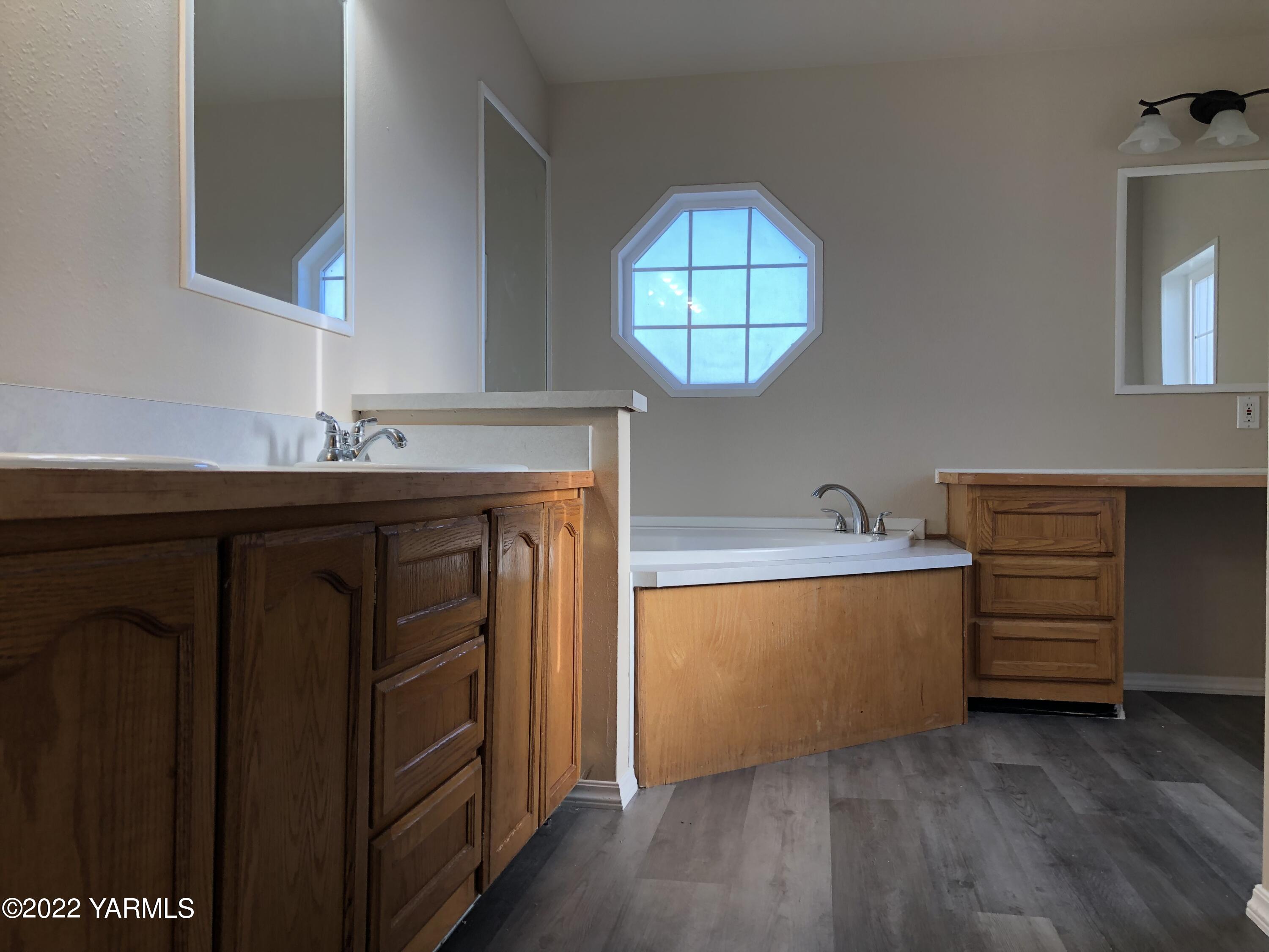 4912 Lateral A Road Wapato, WA 98951 - Photo 18 of 31 a view of a kitchen with cabinets and wooden floor