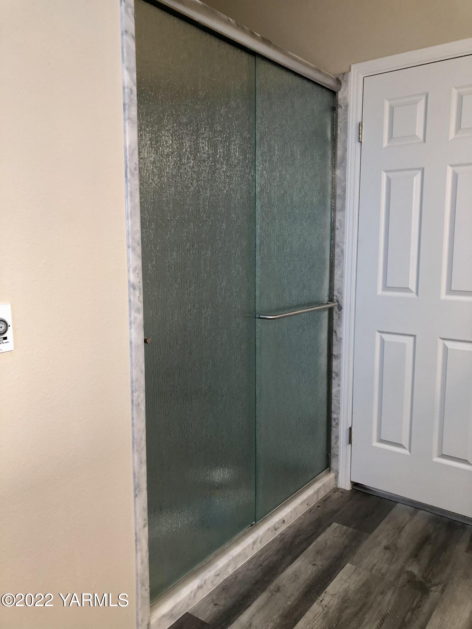 4912 Lateral A Road Wapato, WA 98951 - Photo 19 of 31 a bathroom with a glass shower door