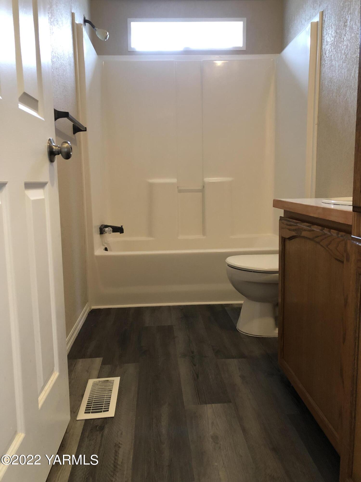 4912 Lateral A Road Wapato, WA 98951 - Photo 23 of 31 a bathroom with a toilet a sink and shower