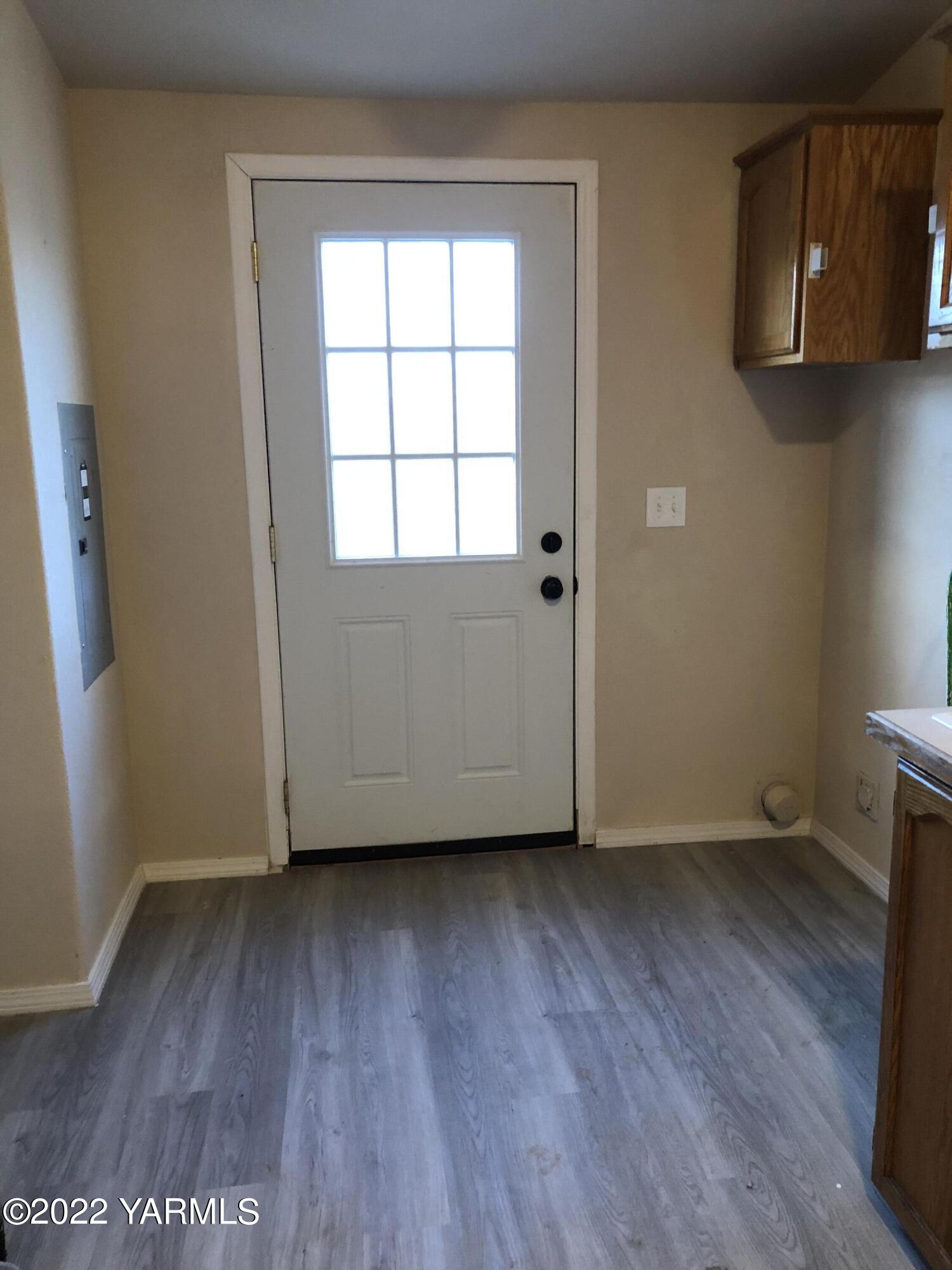 4912 Lateral A Road Wapato, WA 98951 - Photo 26 of 31 an empty room with wooden floor and windows