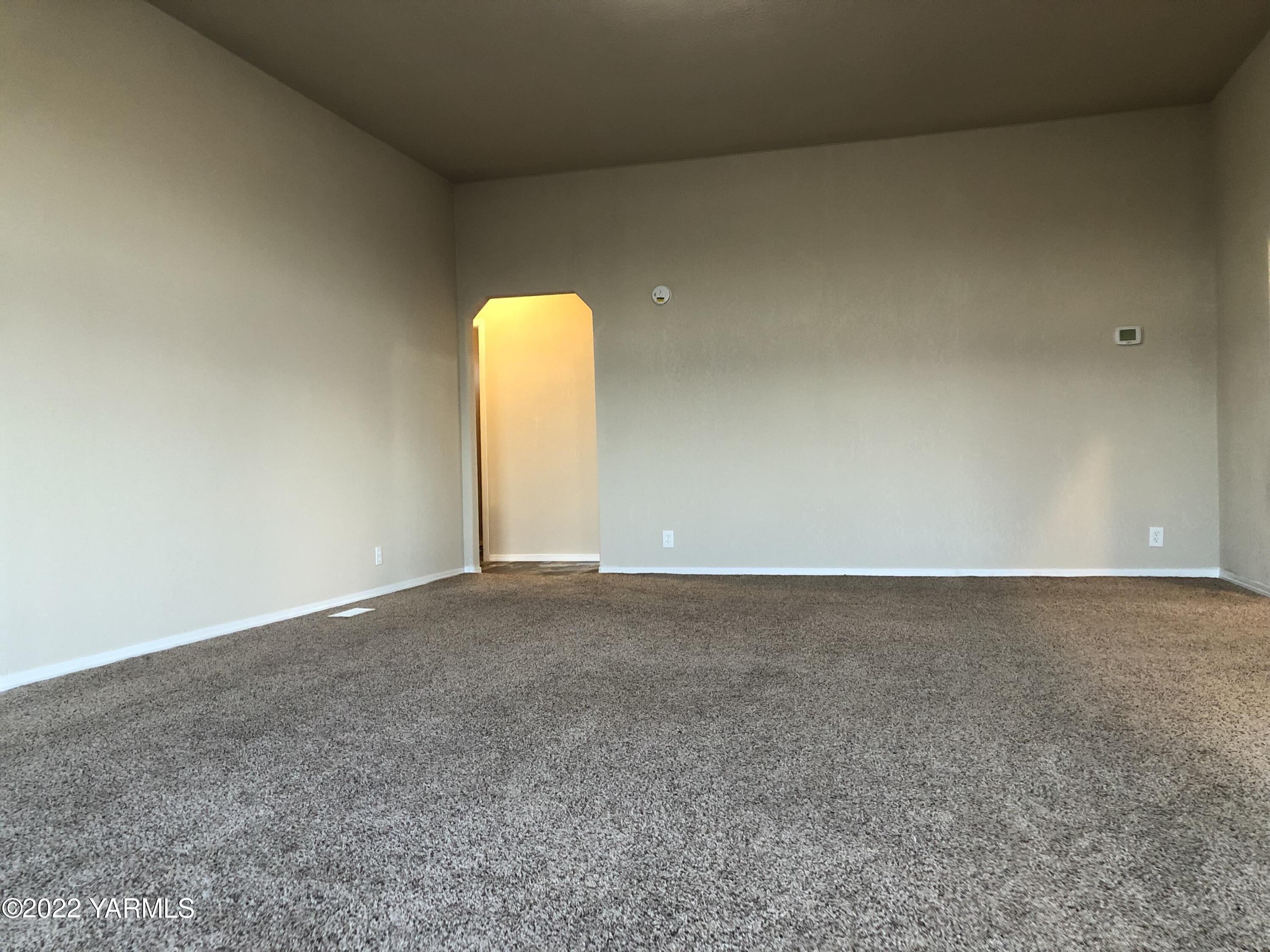4912 Lateral A Road Wapato, WA 98951 - Photo 9 of 31 a view of an empty room and a window