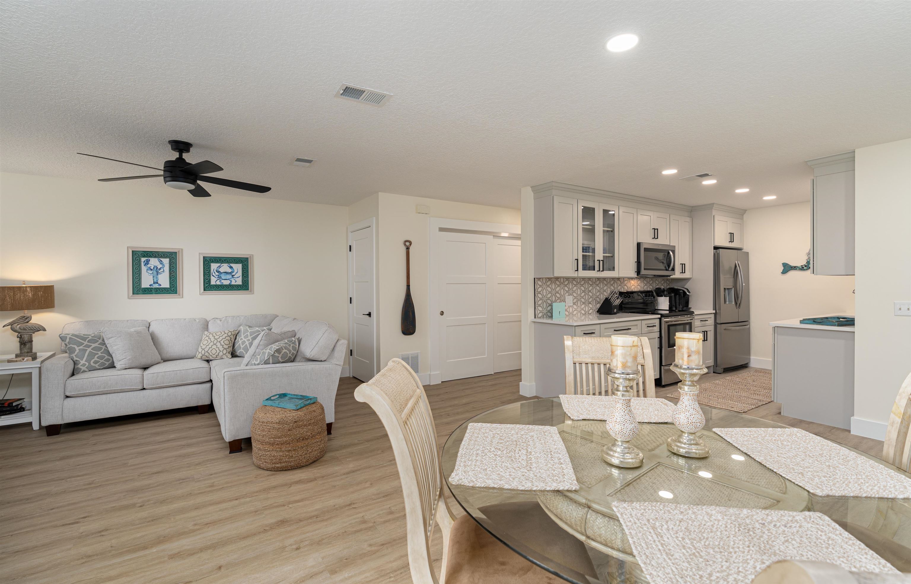 203 E Street St. Augustine, FL 32080 - Photo 14 of 68 Dining room featuring recessed lighting, light wood-style flooring, a ceiling fan, and a textured ceiling