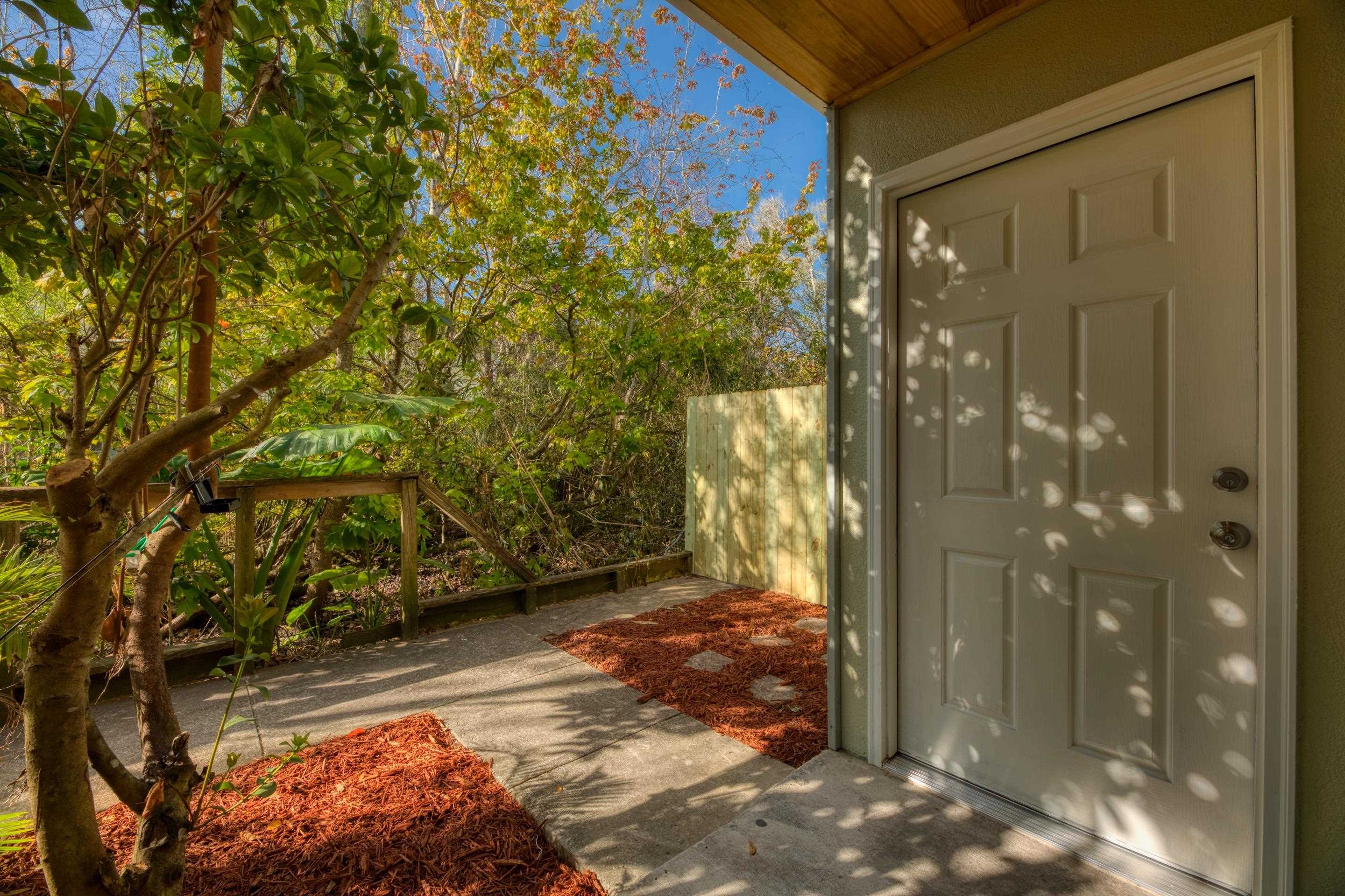 203 E Street St. Augustine, FL 32080 - Photo 28 of 68 Doorway to property with stucco siding