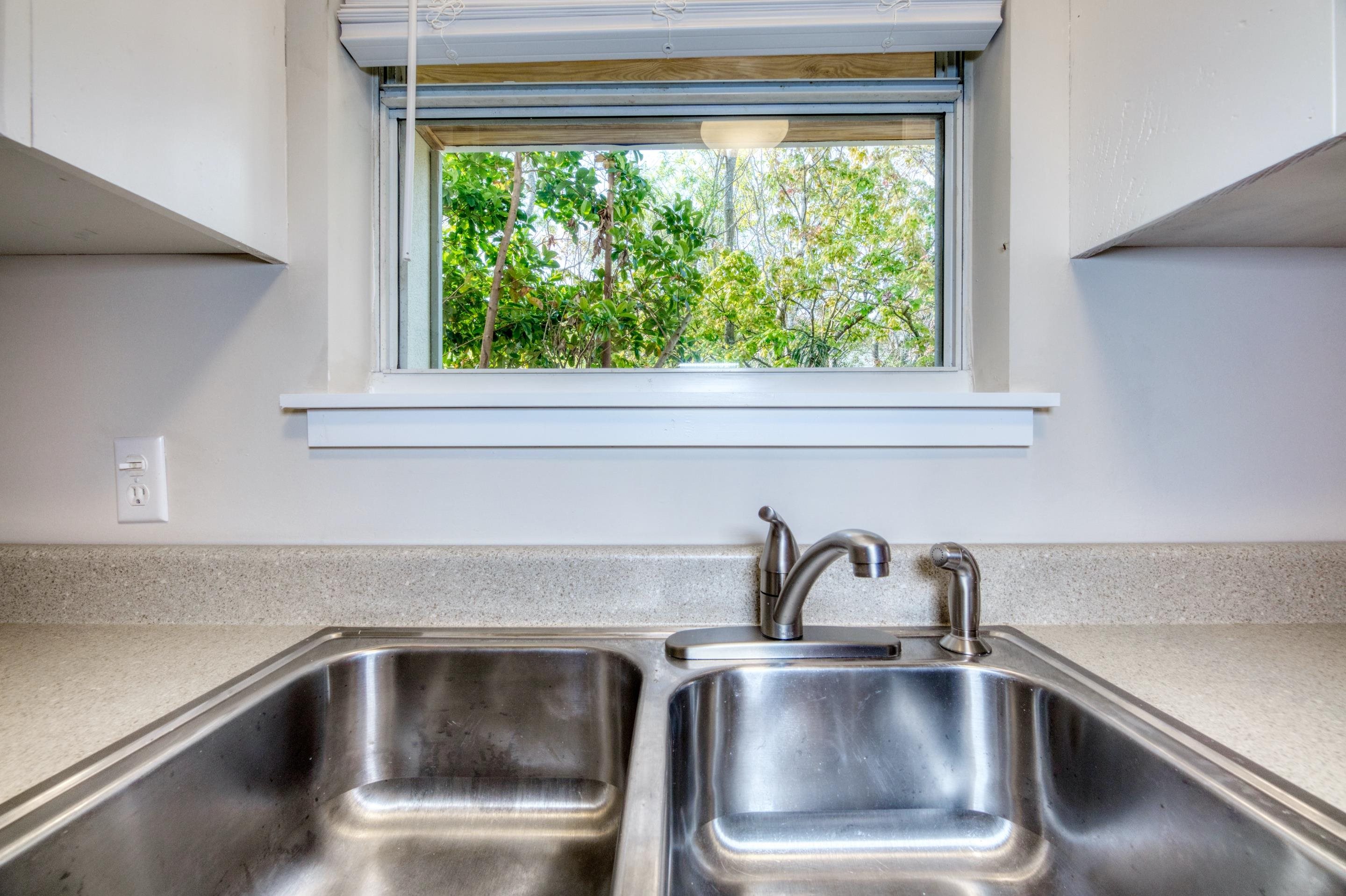 203 E Street St. Augustine, FL 32080 - Photo 40 of 68 Kitchen view of light stone countertops and white cabinets