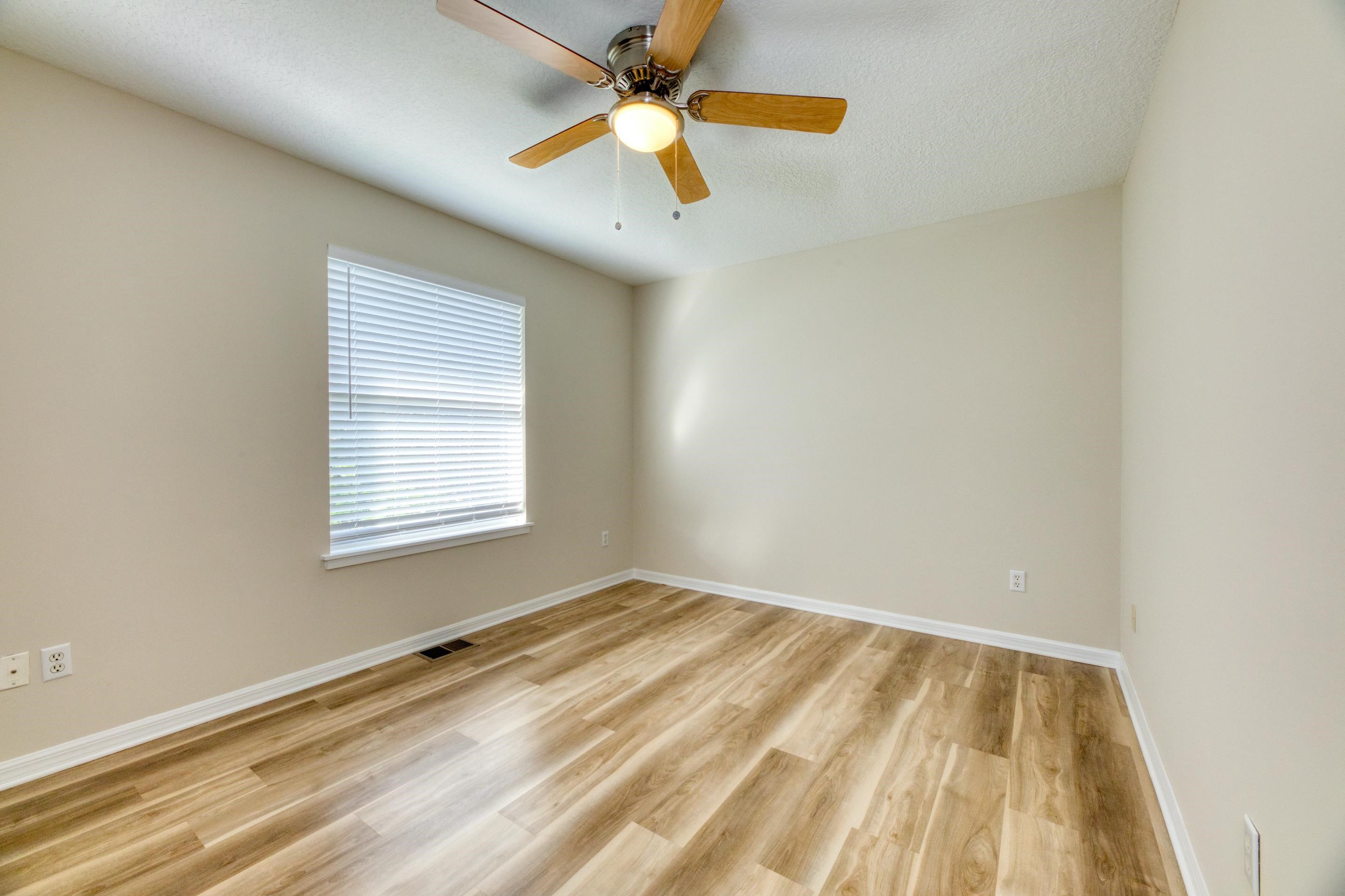 203 E Street St. Augustine, FL 32080 - Photo 41 of 68 Spare room featuring light wood-style flooring, ceiling fan, and a textured ceiling