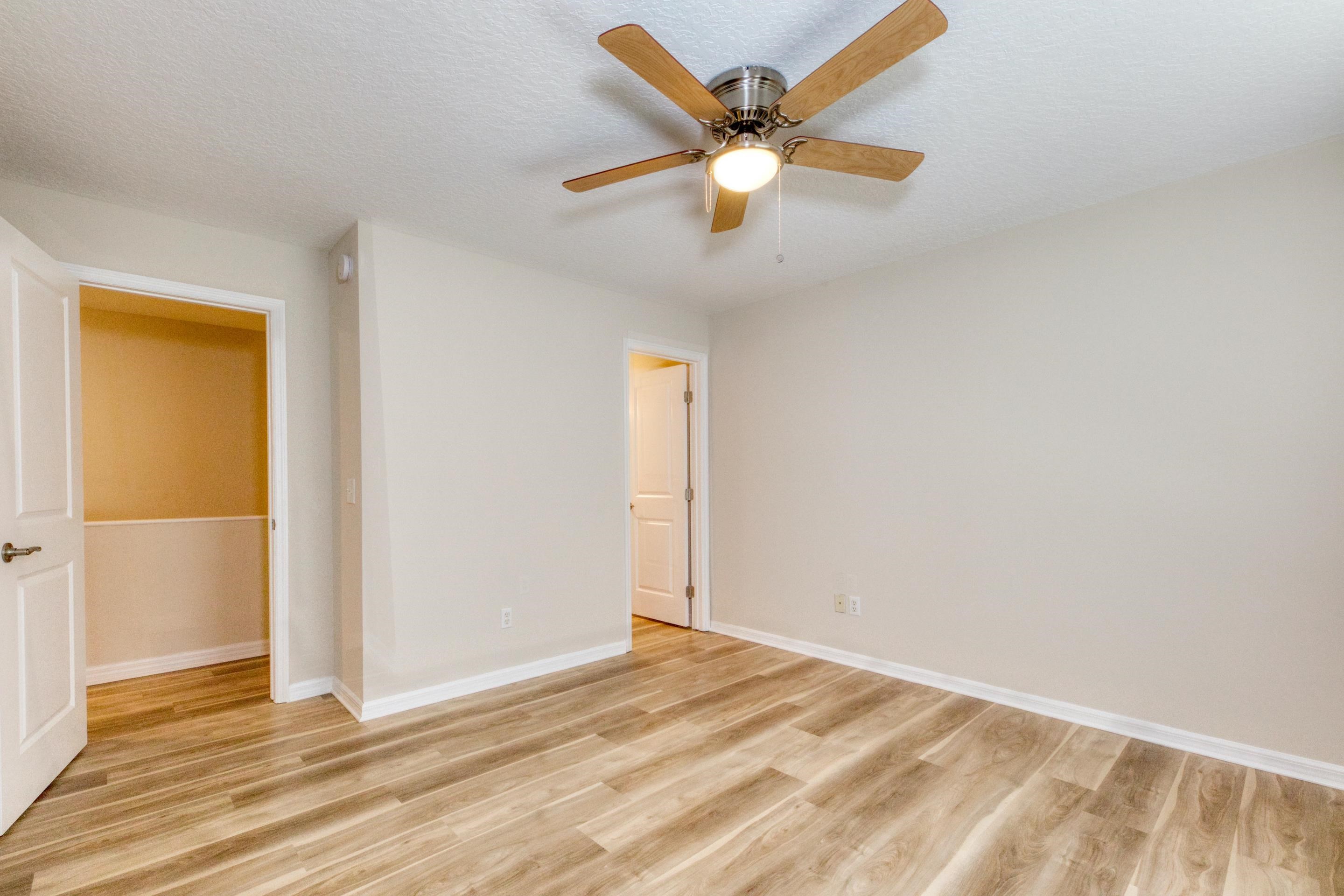203 E Street St. Augustine, FL 32080 - Photo 47 of 68 Unfurnished bedroom featuring a textured ceiling, light wood-style flooring, and ceiling fan