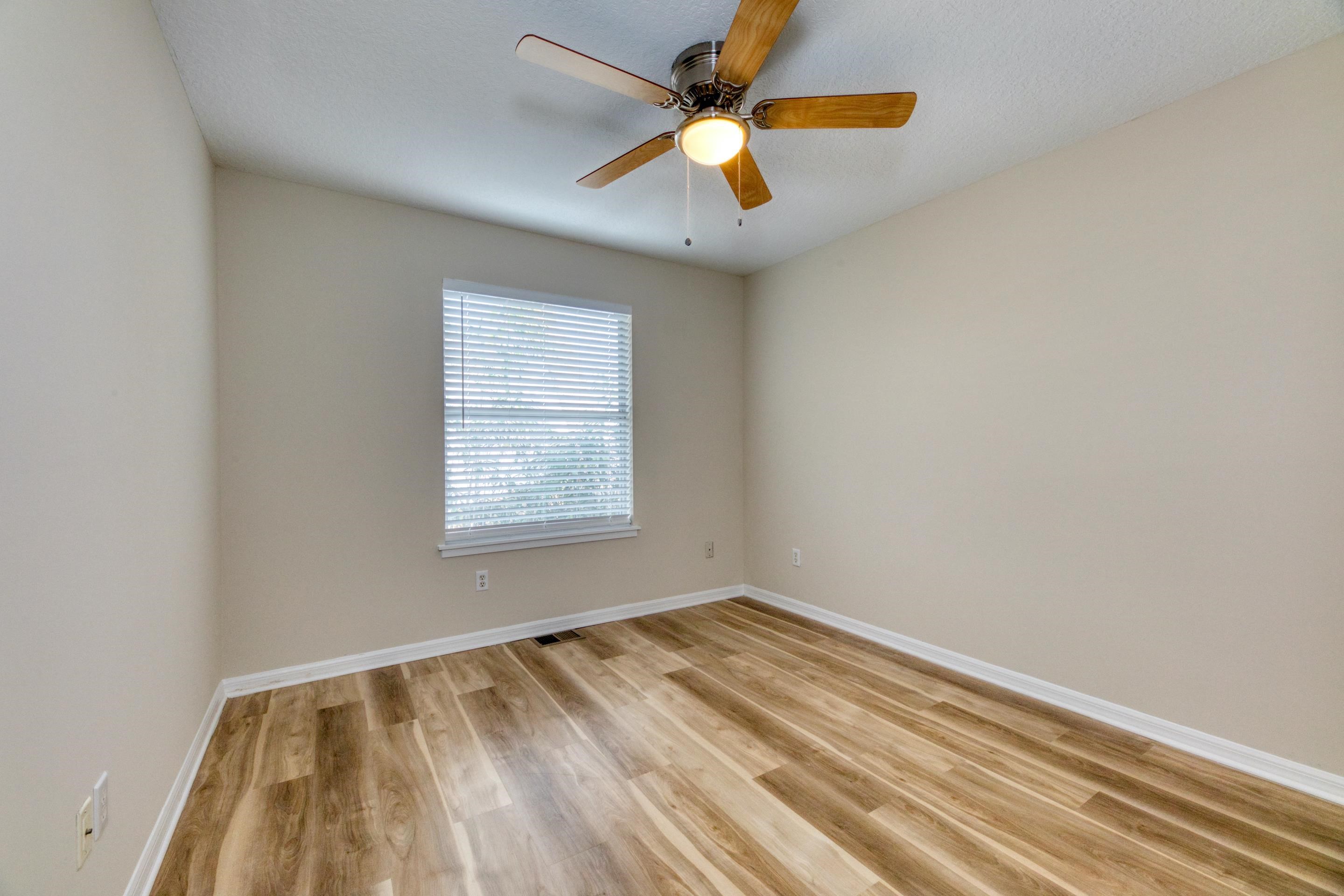 203 E Street St. Augustine, FL 32080 - Photo 49 of 68 Unfurnished room featuring light wood-style flooring and a ceiling fan