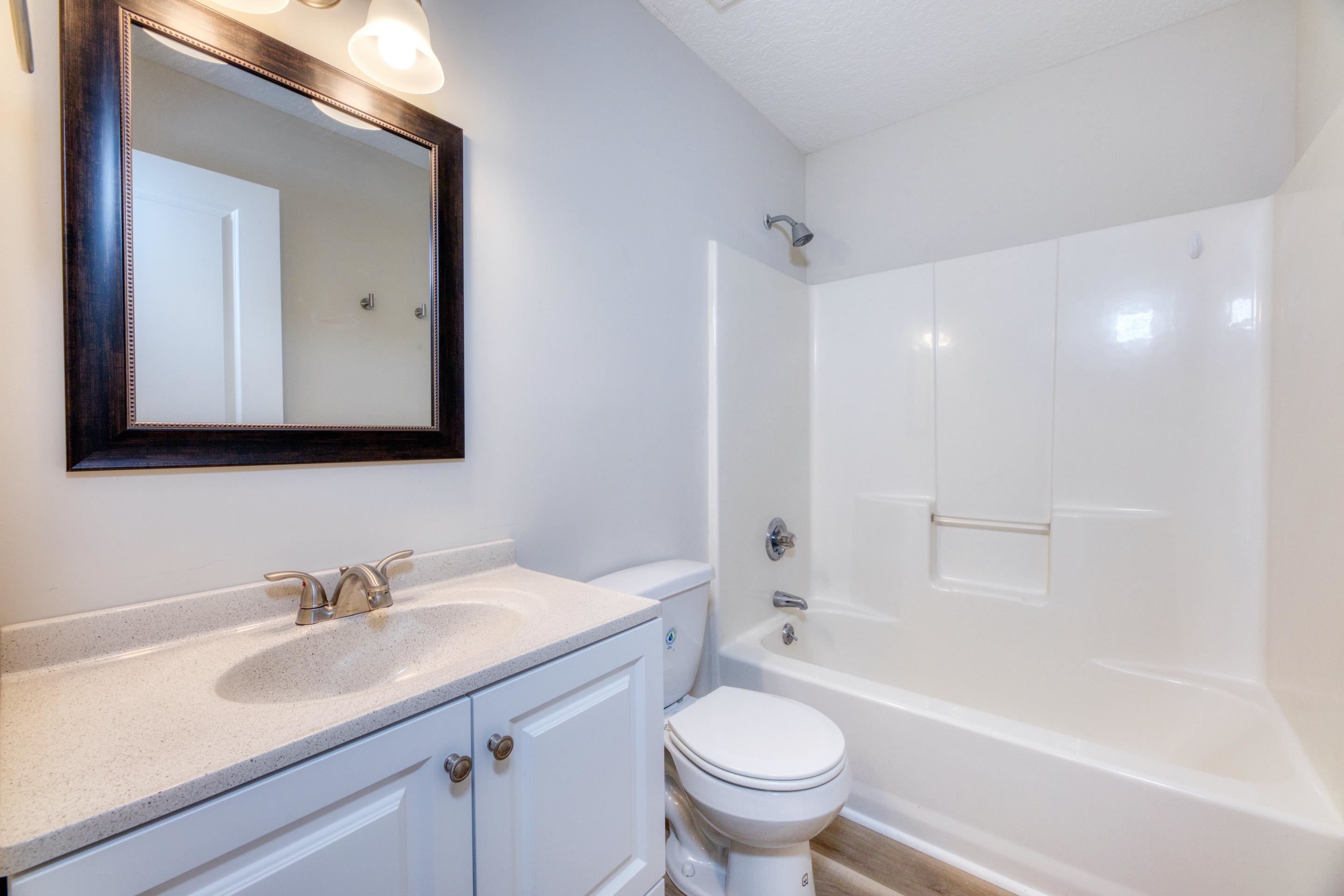 203 E Street St. Augustine, FL 32080 - Photo 52 of 68 Full bathroom with vanity, shower / bathtub combination, and wood finished floors