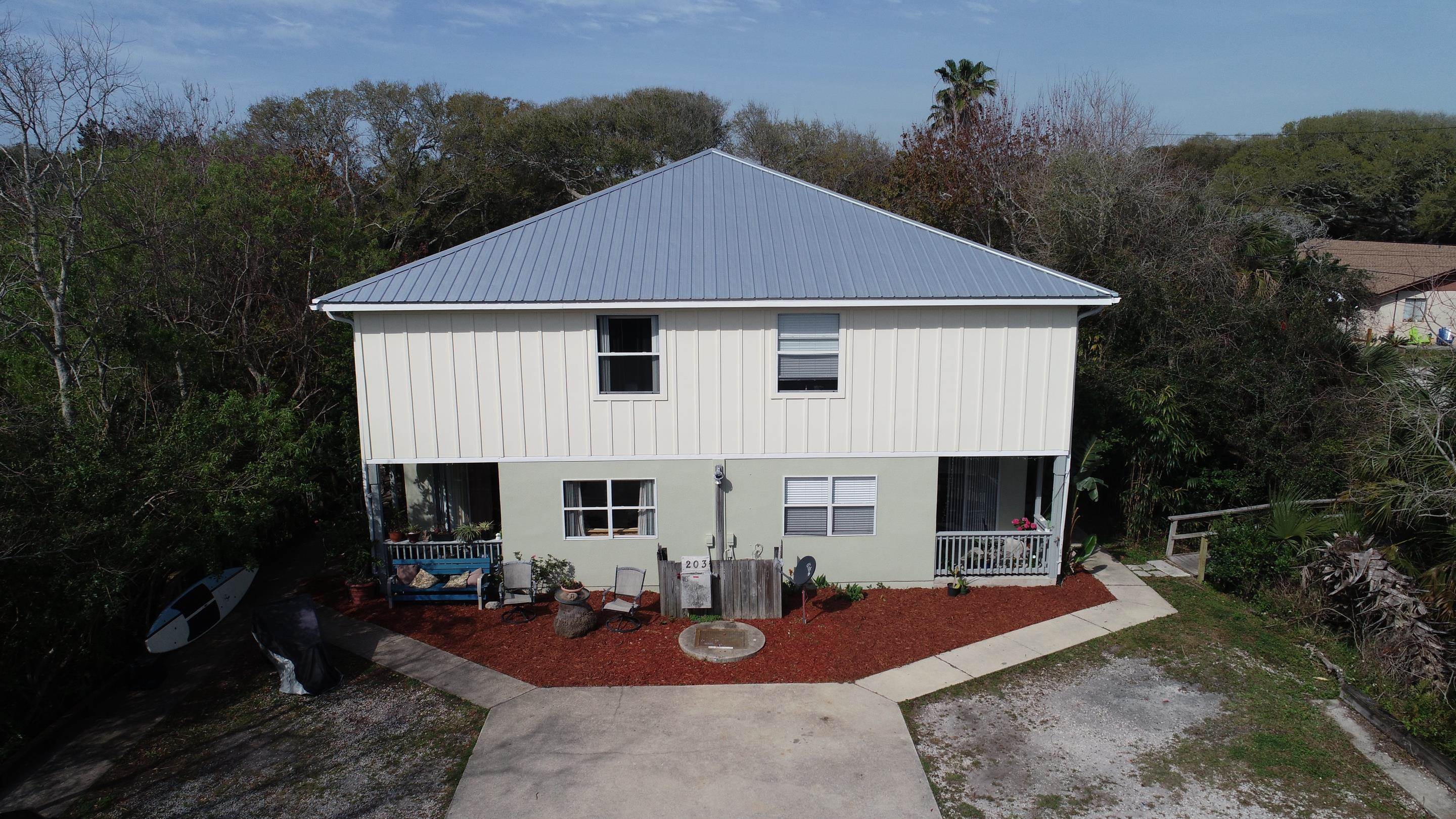 203 E Street St. Augustine, FL 32080 - Photo 59 of 68 View of side of property with a metal roof and board and batten siding