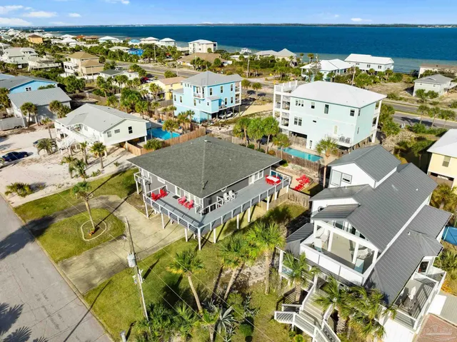 an aerial view of residential houses and outdoor space