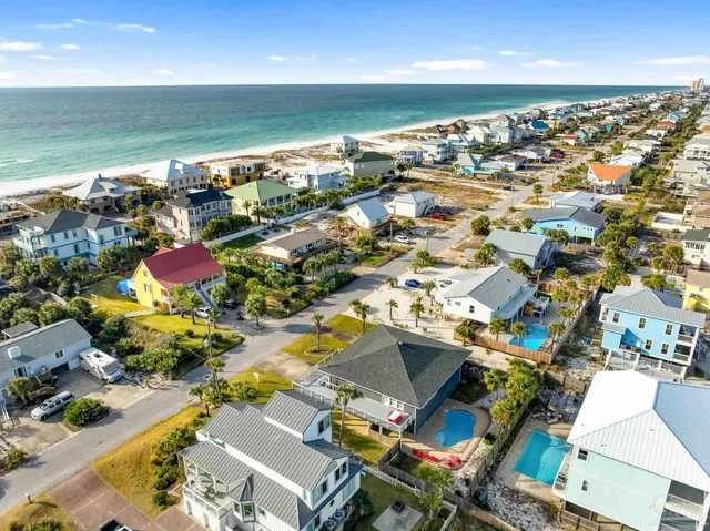 an aerial view of residential houses with outdoor space