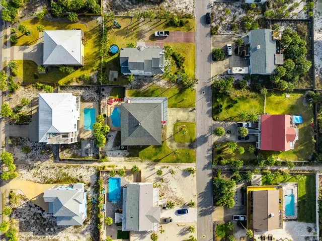 an aerial view of residential building and ocean