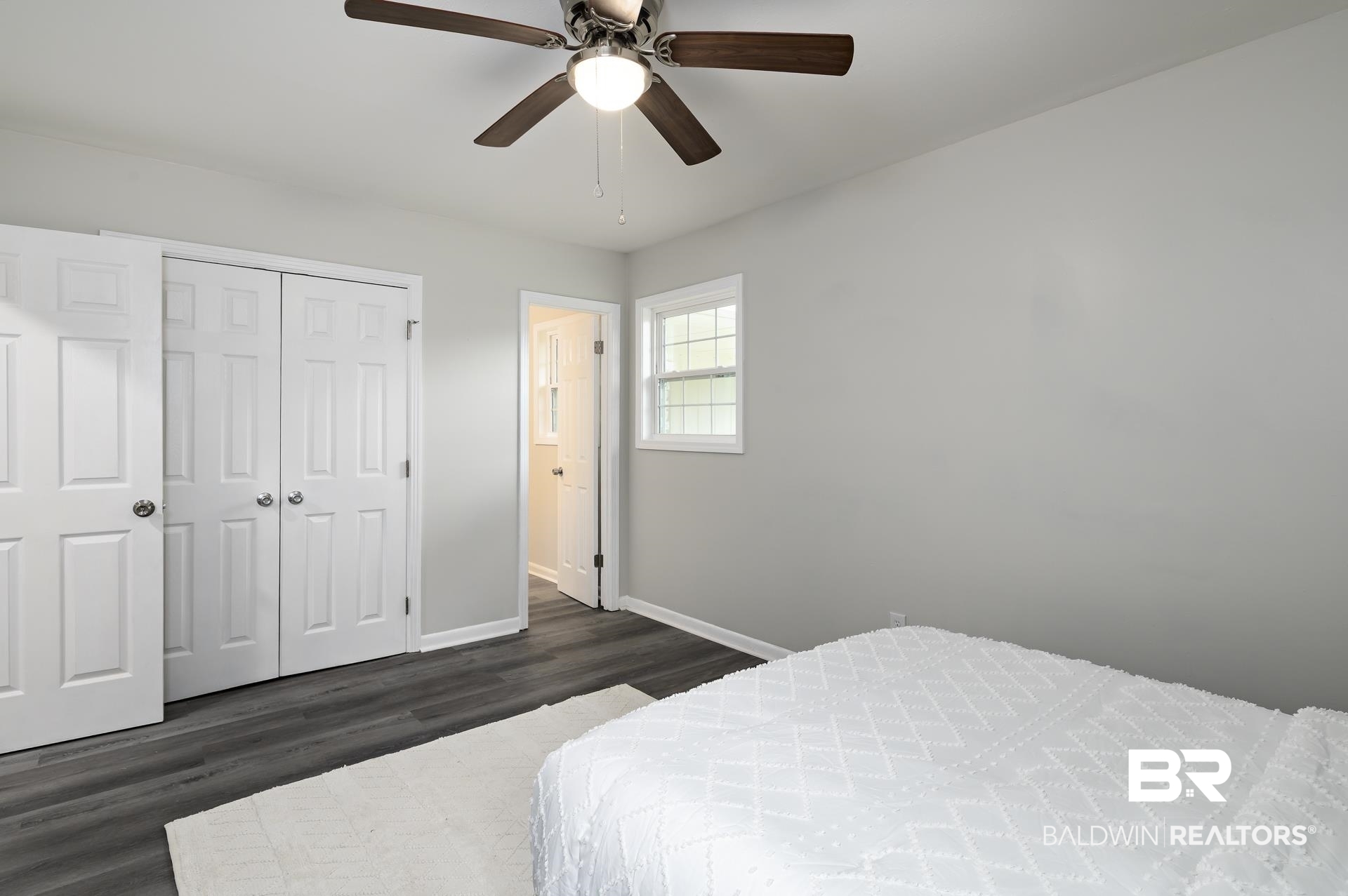 5922 Sunnyside Drive Mobile, AL 36619 - Photo 35 of 51 Bedroom featuring baseboards, dark wood-style flooring, a closet, and ceiling fan