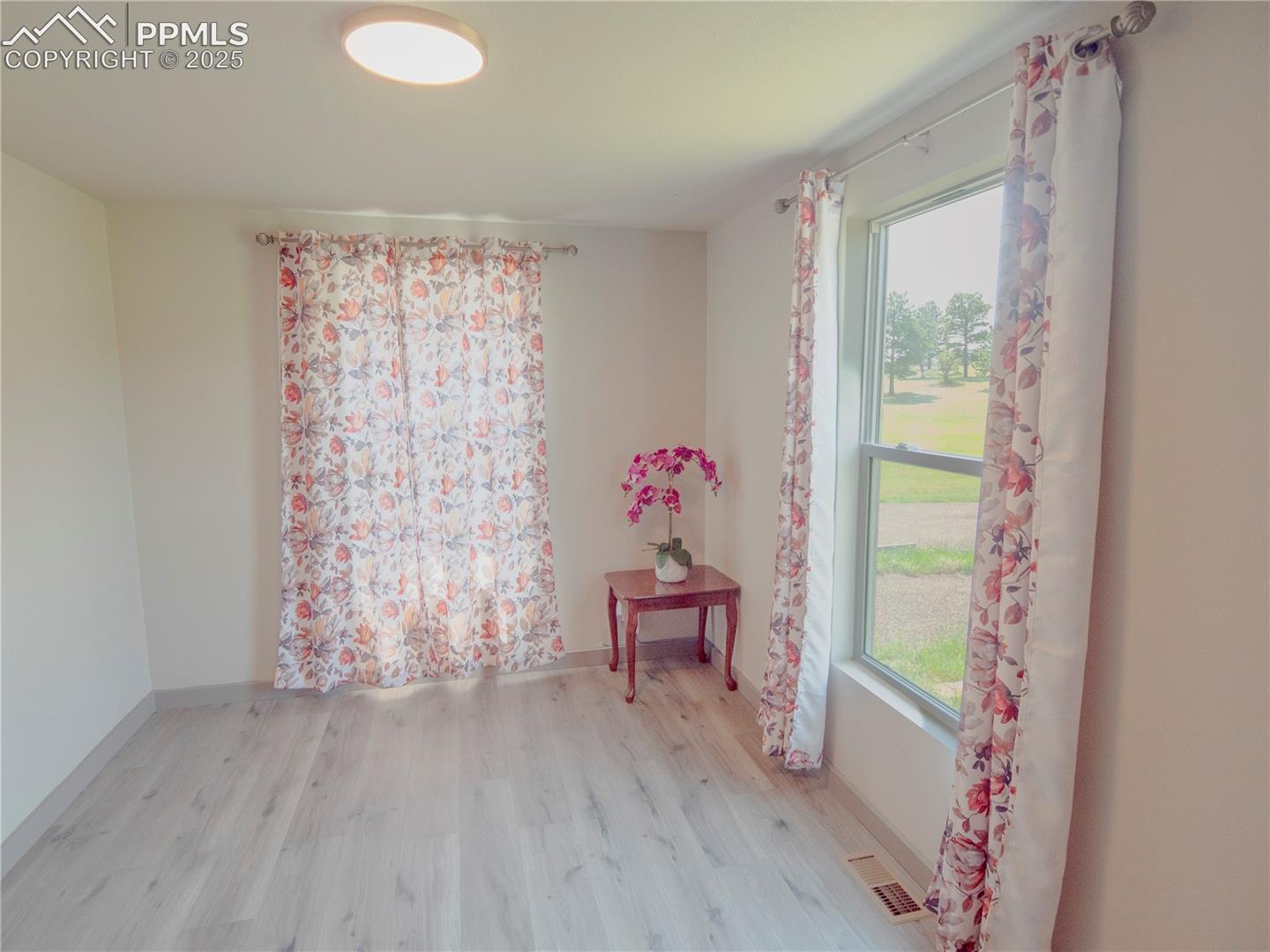 4130 Walker Road Colorado Springs, CO 80908 - Photo 22 of 39 Empty room with wood finished floors