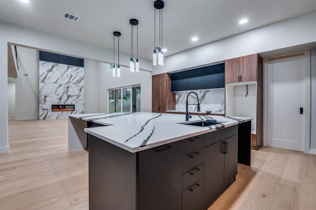 6301 Tiffany Oaks Lane Arlington, TX 76016 - Photo 12 of 40 a kitchen with a counter space a sink and cabinets