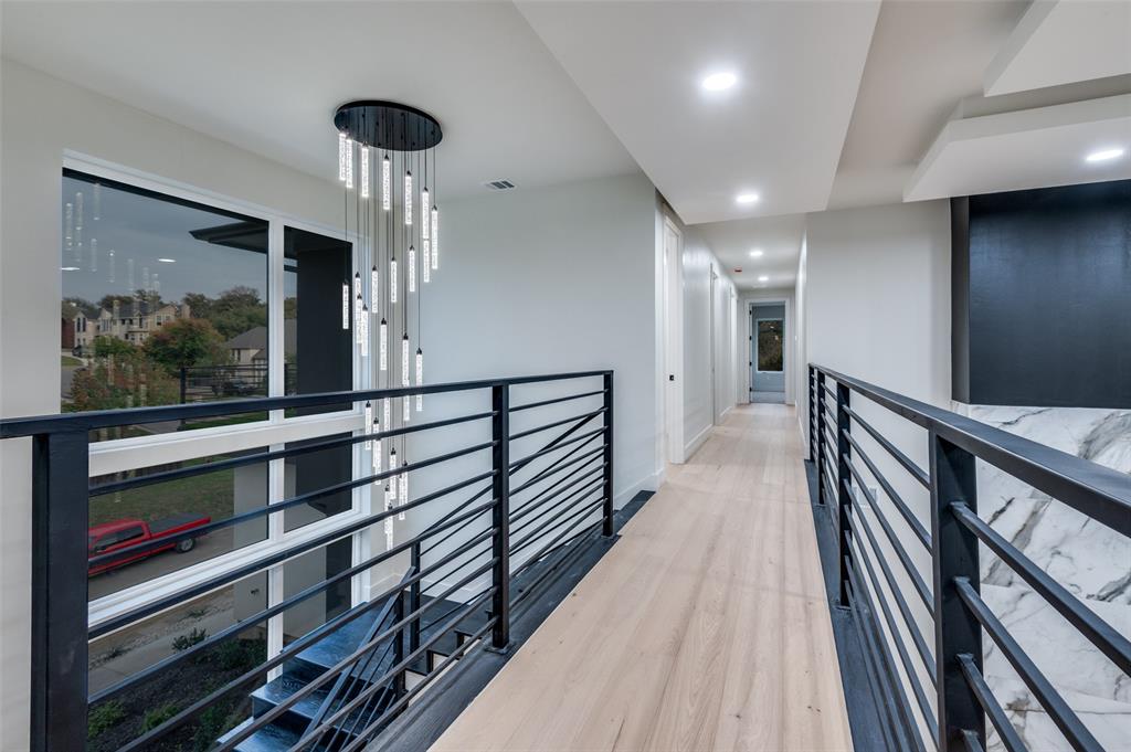 6301 Tiffany Oaks Lane Arlington, TX 76016 - Photo 16 of 40 a view of a hallway with wooden floor and staircase