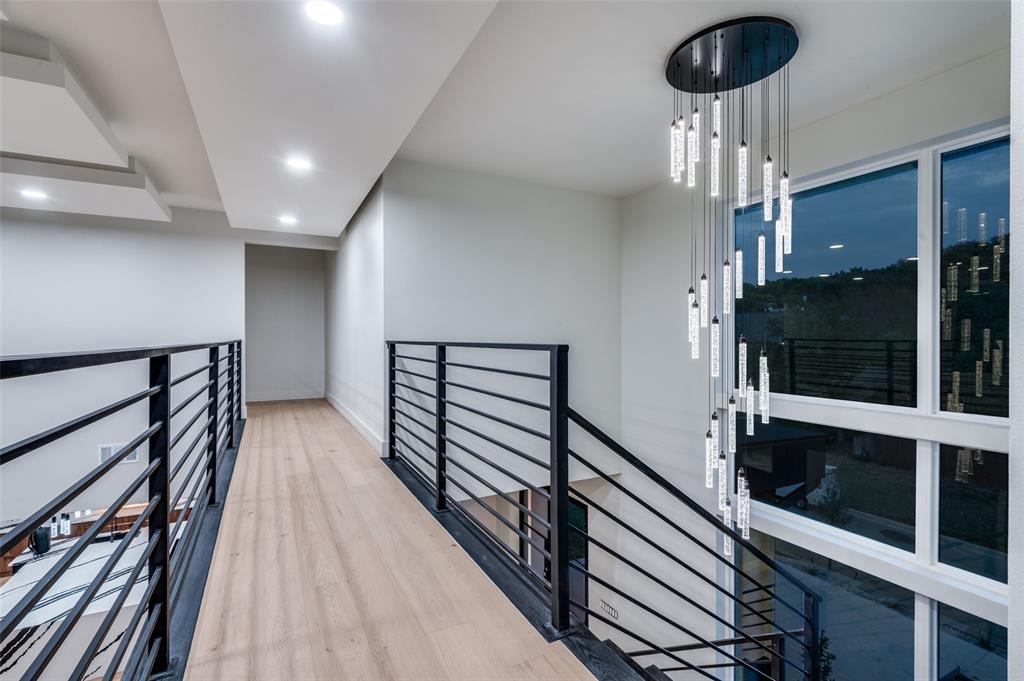 6301 Tiffany Oaks Lane Arlington, TX 76016 - Photo 17 of 40 a view of a hallway with wooden floor and staircase
