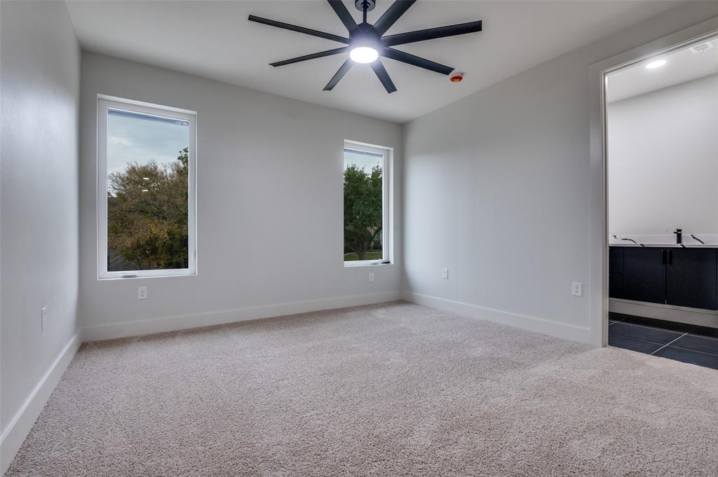 6301 Tiffany Oaks Lane Arlington, TX 76016 - Photo 28 of 40 en empty room with windows and fan