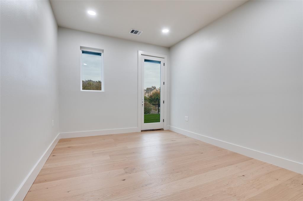 6301 Tiffany Oaks Lane Arlington, TX 76016 - Photo 32 of 40 an empty room with closet and wooden floor
