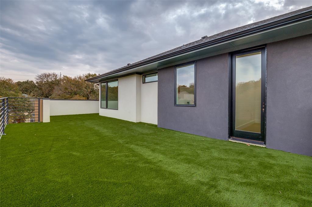 6301 Tiffany Oaks Lane Arlington, TX 76016 - Photo 36 of 40 a backyard of a house with lots of green space and mountain view