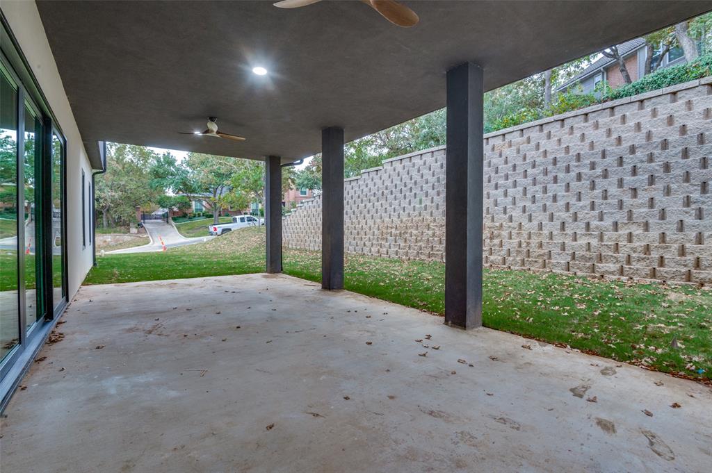 6301 Tiffany Oaks Lane Arlington, TX 76016 - Photo 39 of 40 a view of a yard with porch and wooden fence
