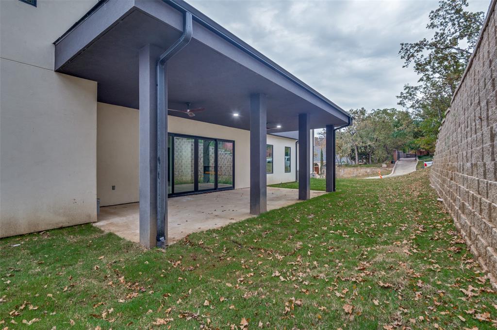 6301 Tiffany Oaks Lane Arlington, TX 76016 - Photo 40 of 40 a view of a house with backyard and porch