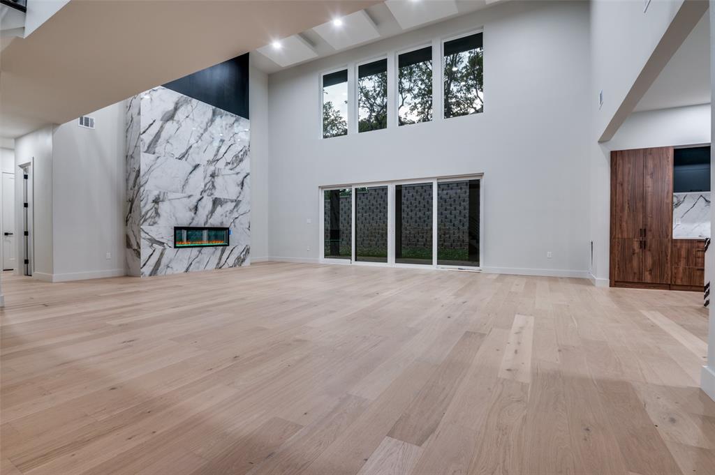 6301 Tiffany Oaks Lane Arlington, TX 76016 - Photo 5 of 40 a view of an empty room with a fireplace