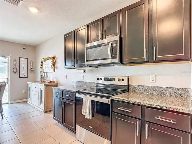 a view of a dining room with furniture and windows