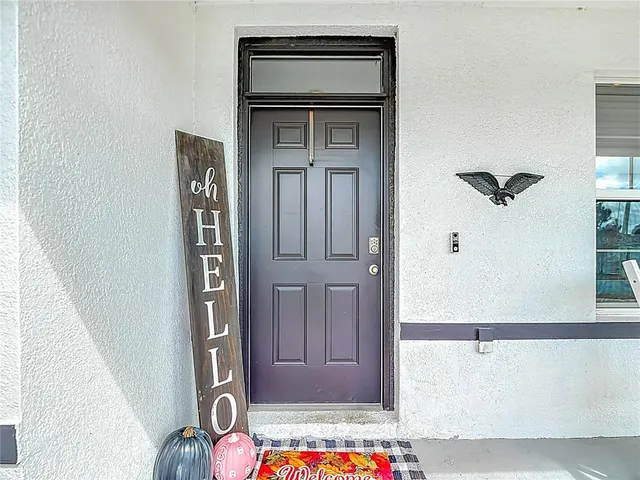a living room with furniture and flowers