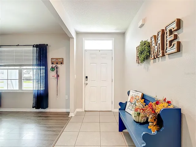 a bedroom with furniture and large window