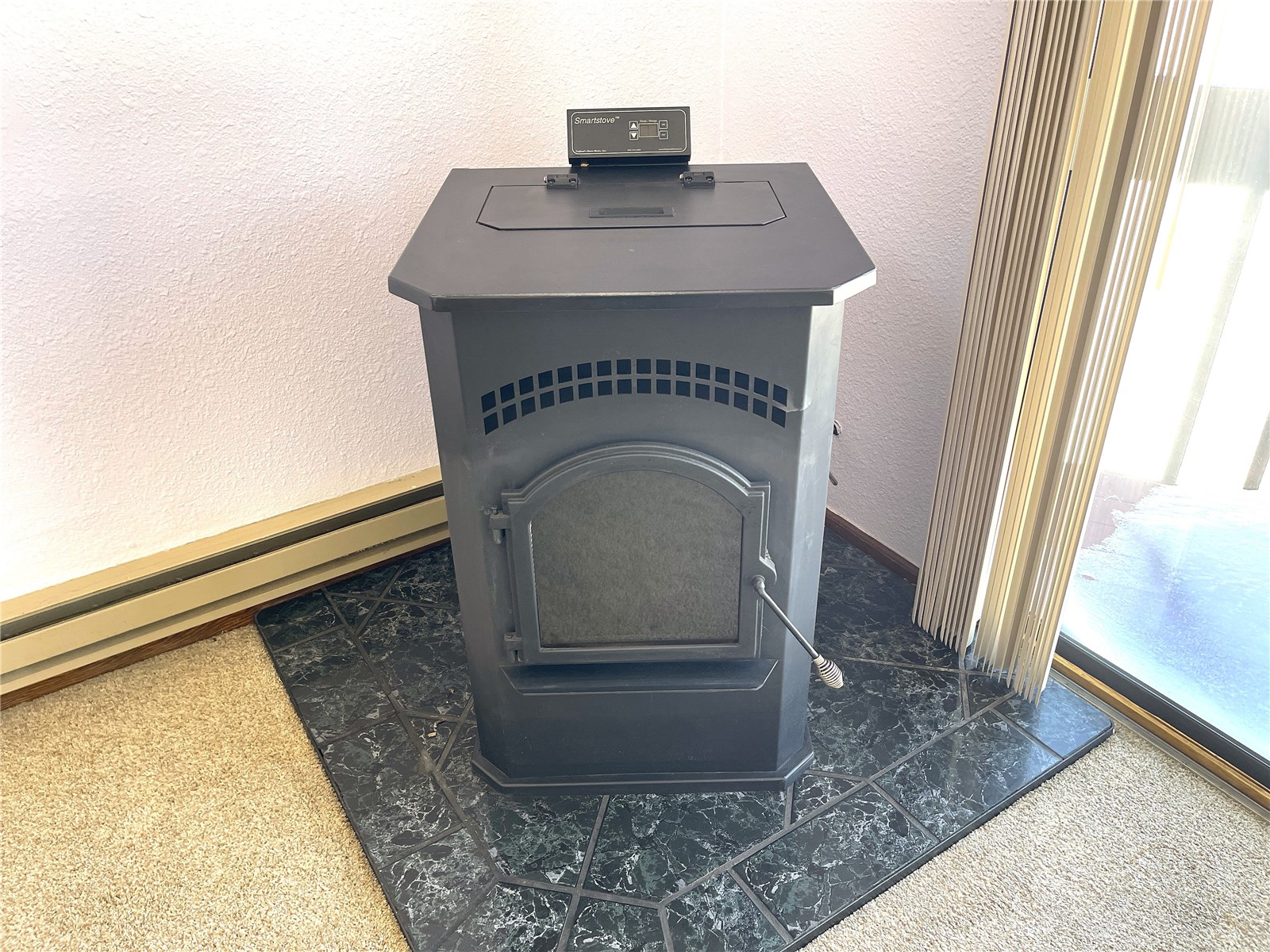 2584 High Creek Road Fairplay, CO 80440 - Photo 15 of 50 Pellet stove in on thermostat in the living room
