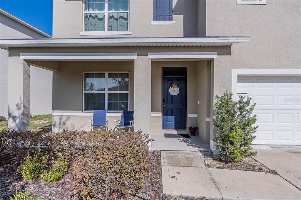 3883 Resting Robin Avenue Bartow, FL 33830 - Photo 2 of 44 front view of a house with potted plants
