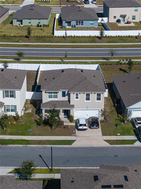3883 Resting Robin Avenue Bartow, FL 33830 - Photo 41 of 44 an aerial view of a house with a garden