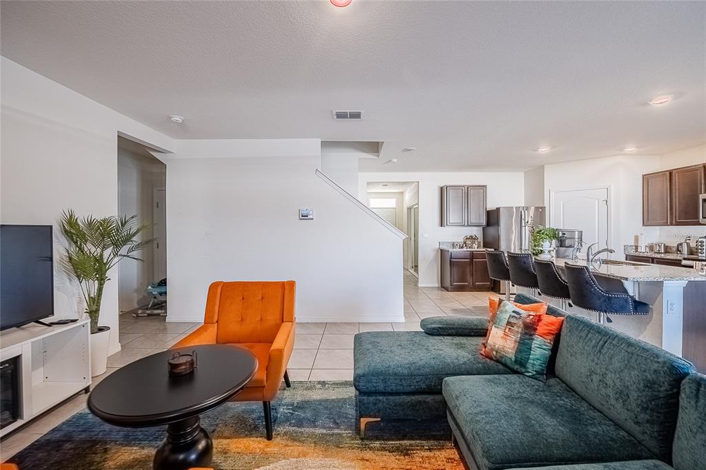 3883 Resting Robin Avenue Bartow, FL 33830 - Photo 5 of 44 a living room with furniture and wooden floor
