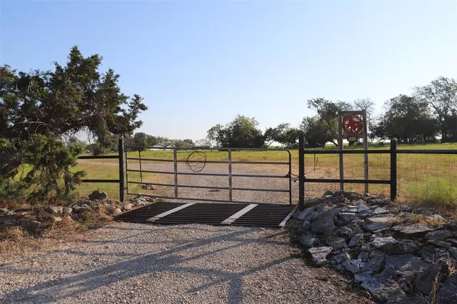 a view of a bench next to a yard