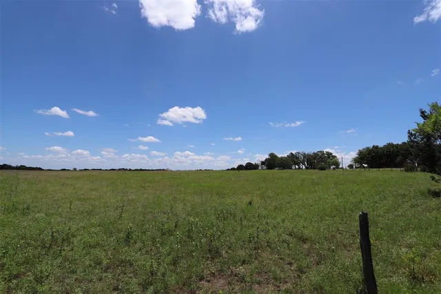 a view of a golf course with a big yard