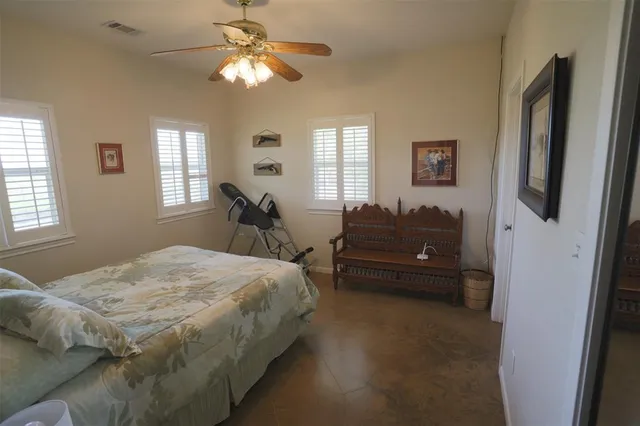 a bed room with a bed and a chandelier
