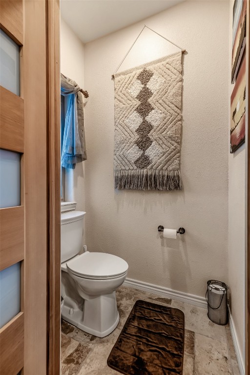 53 Anhinga Road Como, CO 80432 - Photo 21 of 45 a bathroom with a toilet and a shower curtain