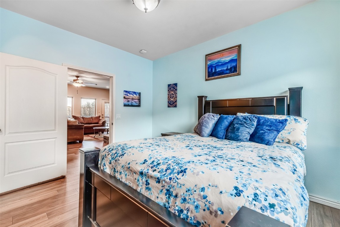 53 Anhinga Road Como, CO 80432 - Photo 23 of 45 a bedroom with a bed and wooden floor