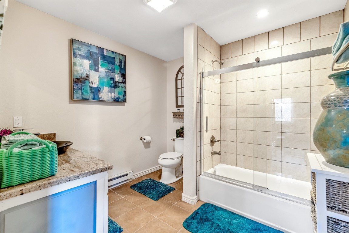 53 Anhinga Road Como, CO 80432 - Photo 30 of 45 a bathroom with a granite countertop bathtub sink vanity mirror and toilet