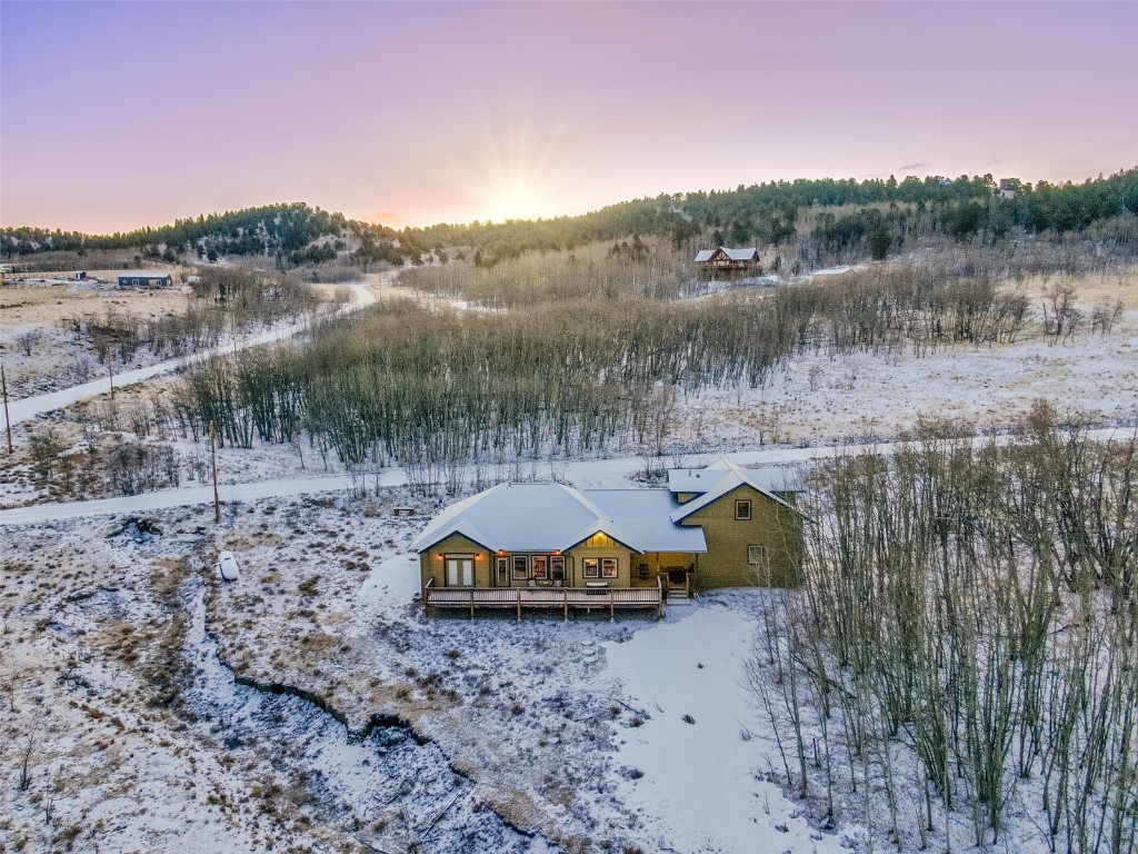 53 Anhinga Road Como, CO 80432 - Photo 35 of 45 a aerial view of a house with a garden and a lake view