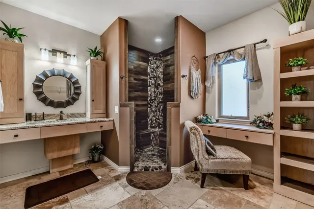 a living room with a couch and a chandelier