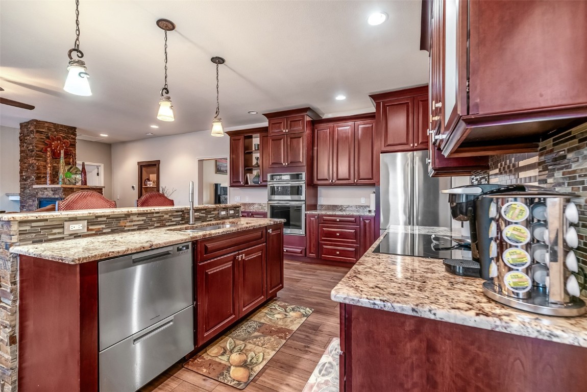 53 Anhinga Road Como, CO 80432 - Photo 9 of 45 a kitchen with stainless steel appliances granite countertop a stove a sink and a refrigerator